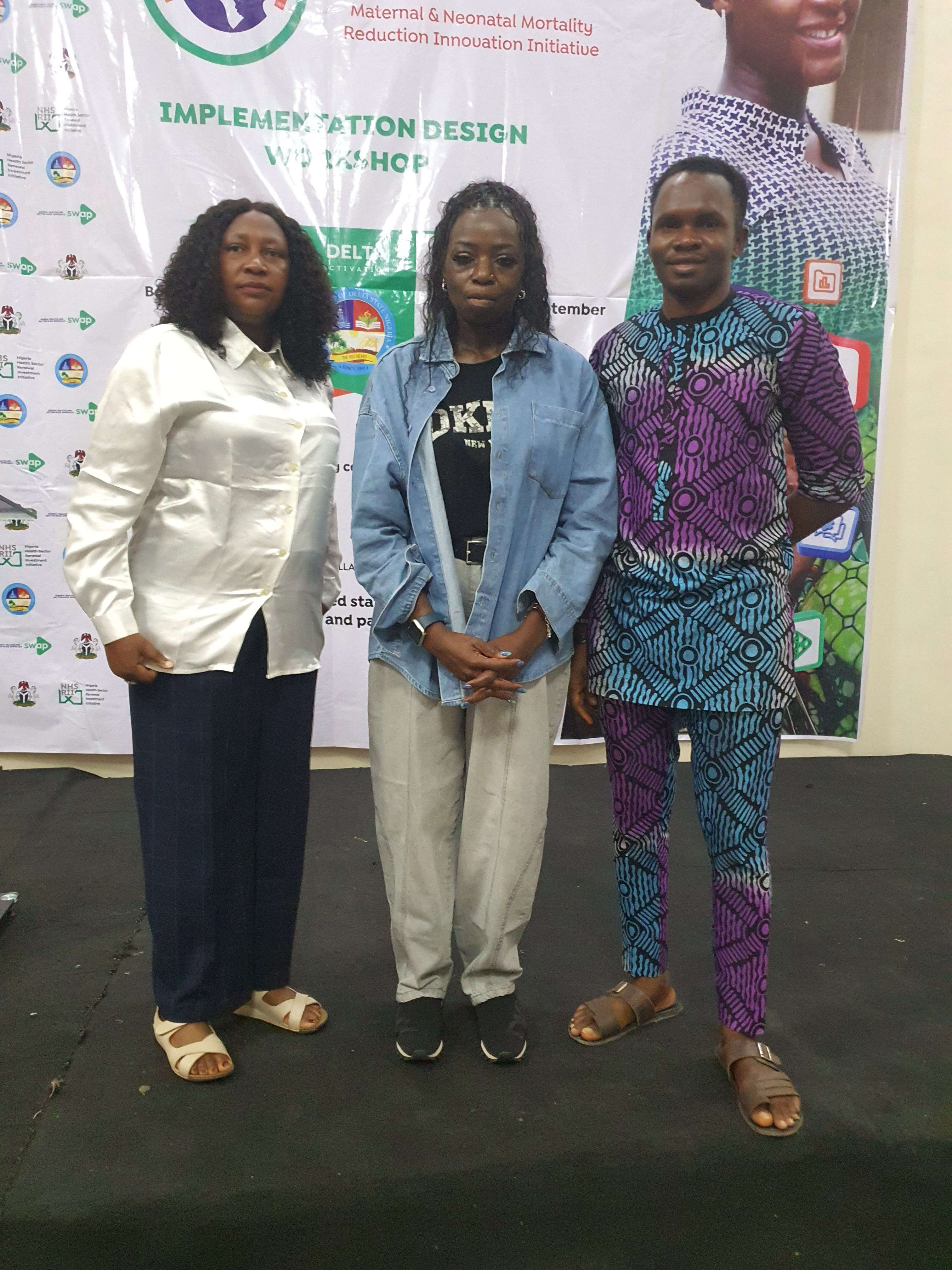 Three delegates at the Maternal & Neonatal Mortality Reduction Innovation Initiative workshop